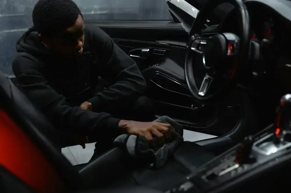 Professional wiping interior dashboard