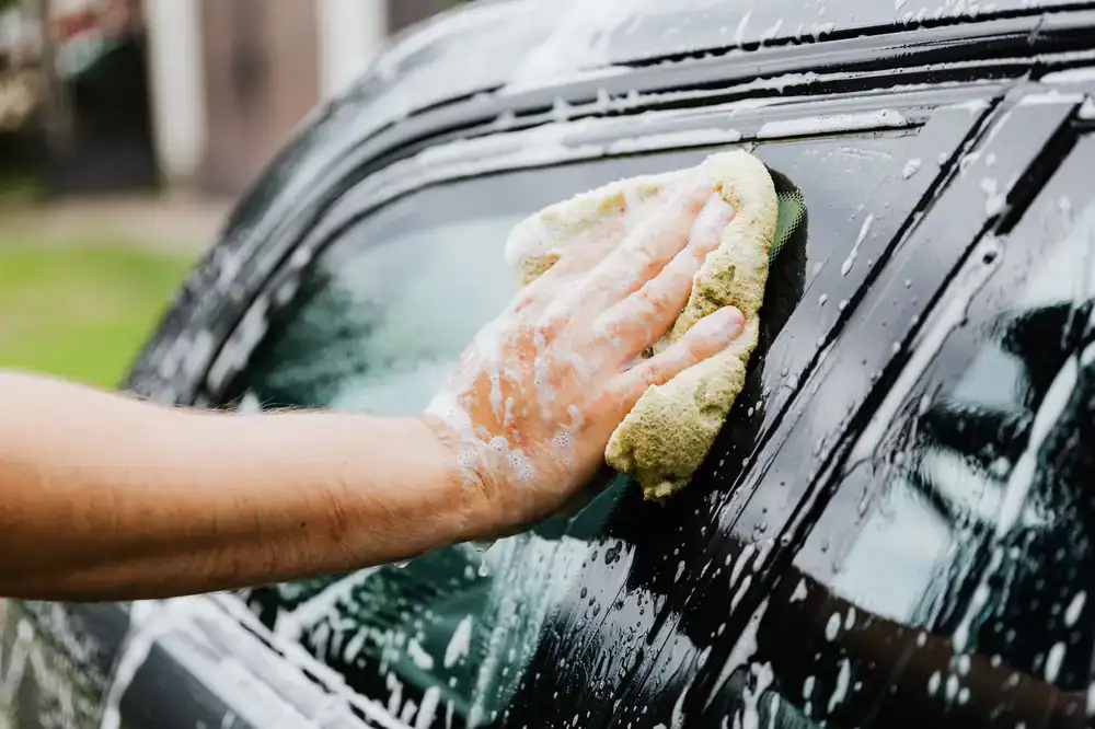 Hand washing car exterior
