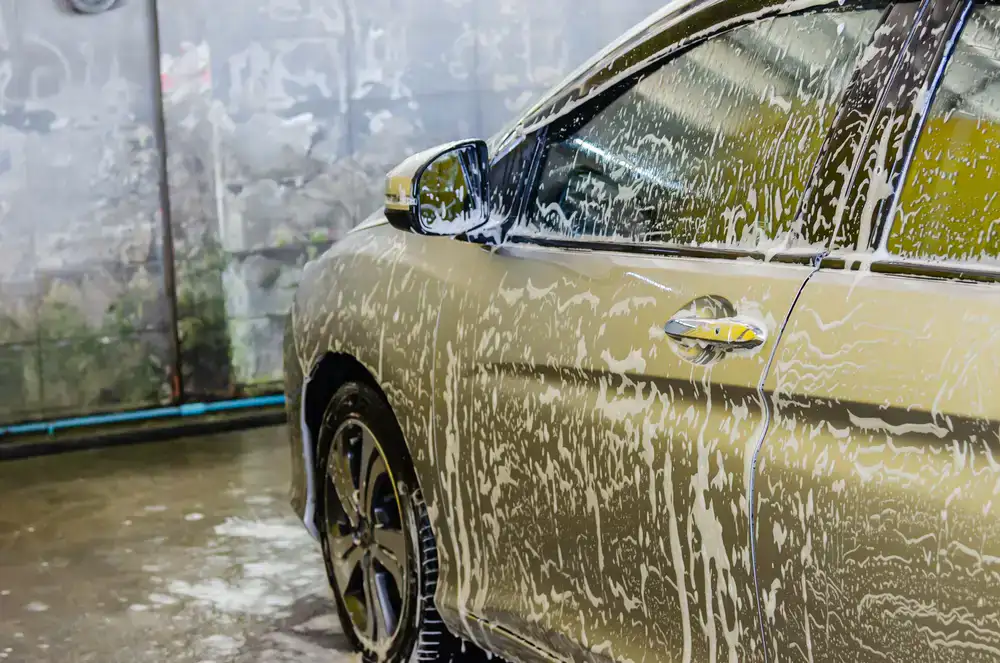 Professional mobile valeting unit cleaning a gleaming car